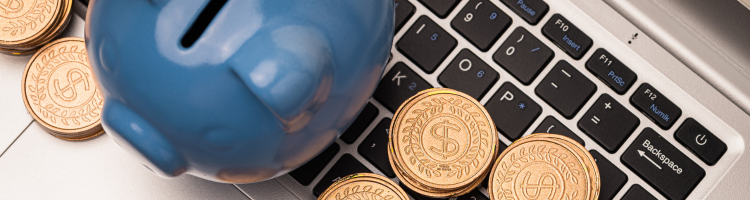 coins laptop and piggybank